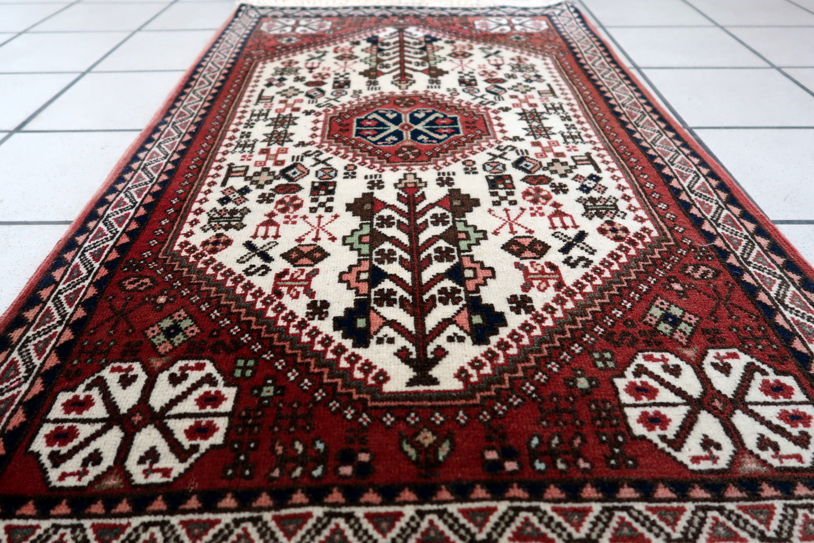 Side angle view of the rug, emphasizing its durability and well-preserved condition