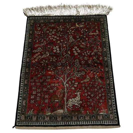 Handmade vintage Persian Qum silk rug featuring the "tree of life" design with intricate animal motifs