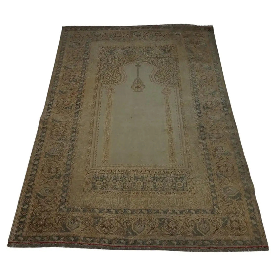 Handmade antique Turkish Transilvania prayer rug featuring intricate motifs and muted earthy tones from the 1880s