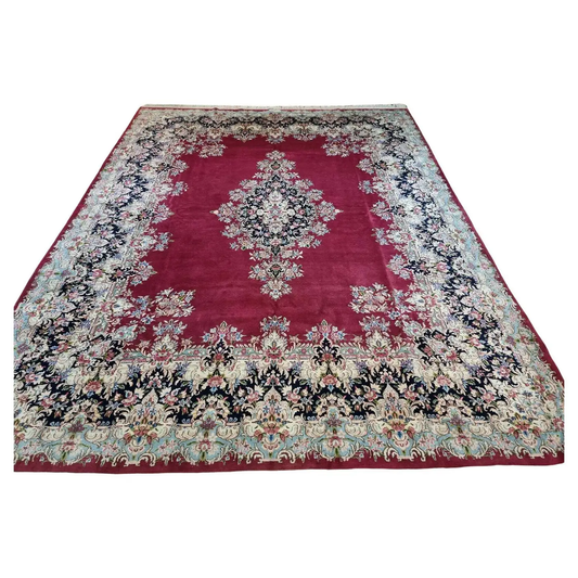 Handmade Vintage Persian Kerman Rug - 1970s - Wool rug featuring intricate floral and vine designs in deep red tones