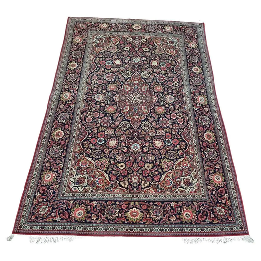 Handmade Antique Persian Kashan Rug - 1920s - Complex pattern with dark base color and multicolored designs.