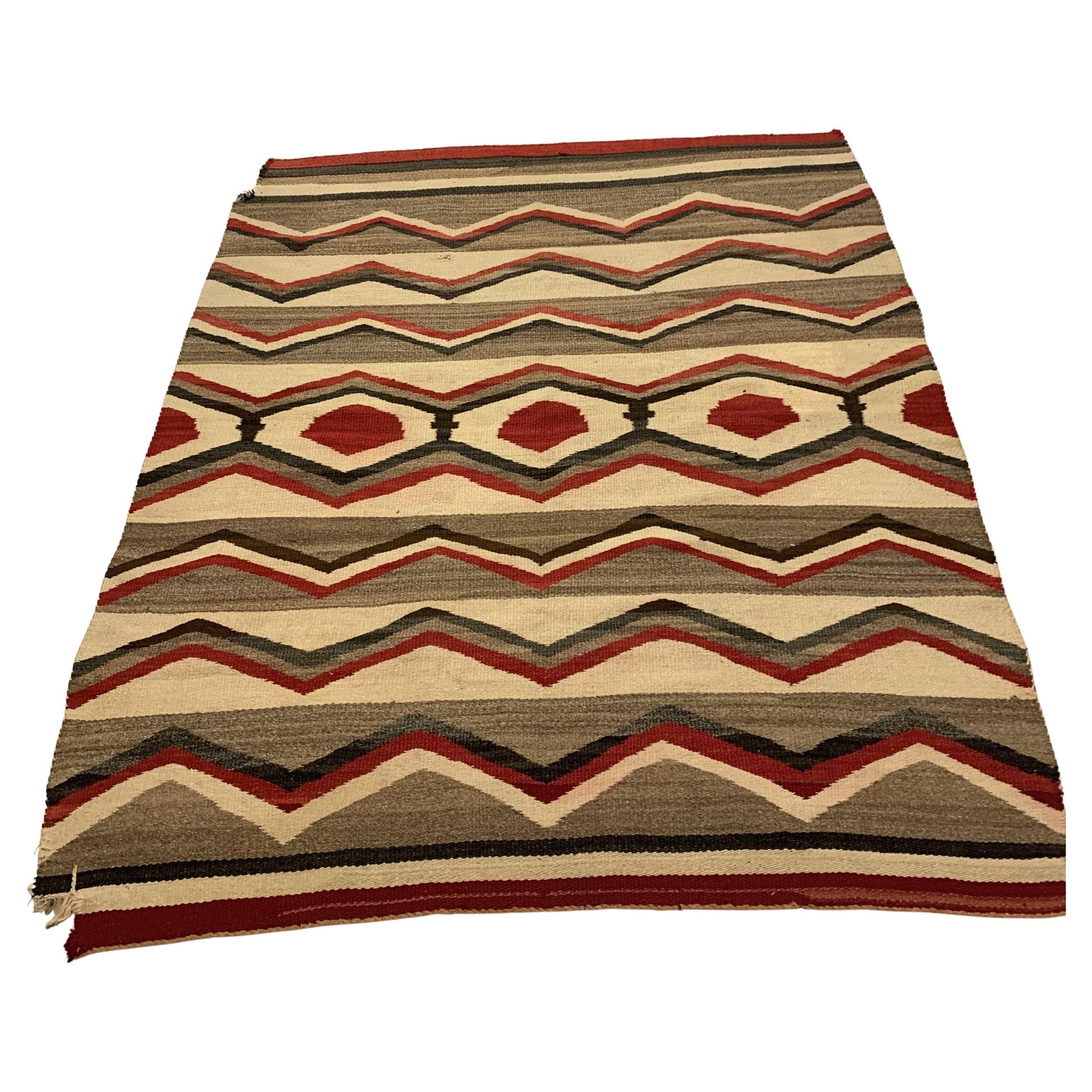 Handmade Antique Native American Navajo Rug Blanket displayed draped over a sofa