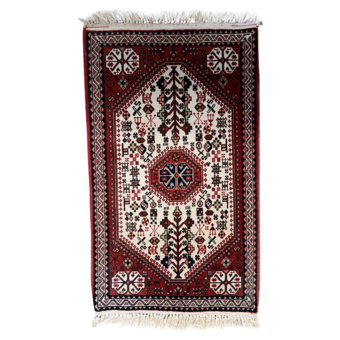 Handmade Vintage Persian Gashkai Rug showcasing intricate woven designs in deep reds, creams, and blues