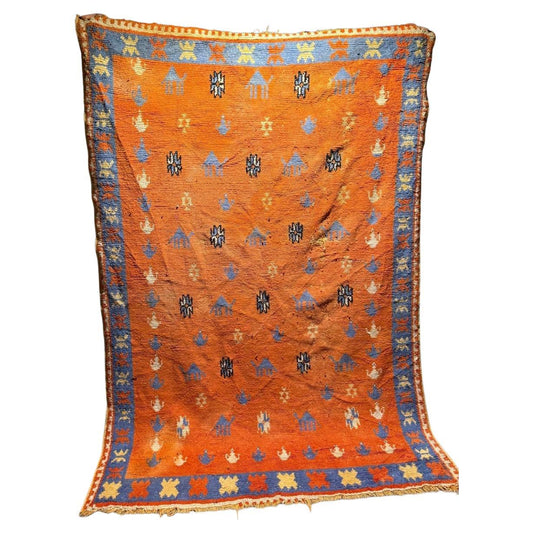 handmade antique Moroccan Berber rug with terracotta orange field
