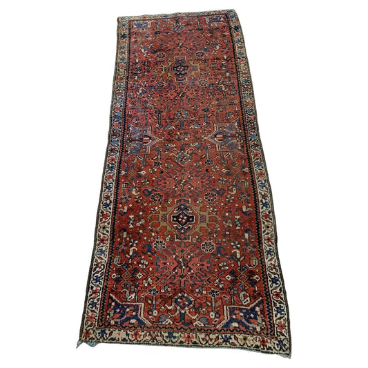 antique Persian Karajeh rug with red field and tribal motifs
