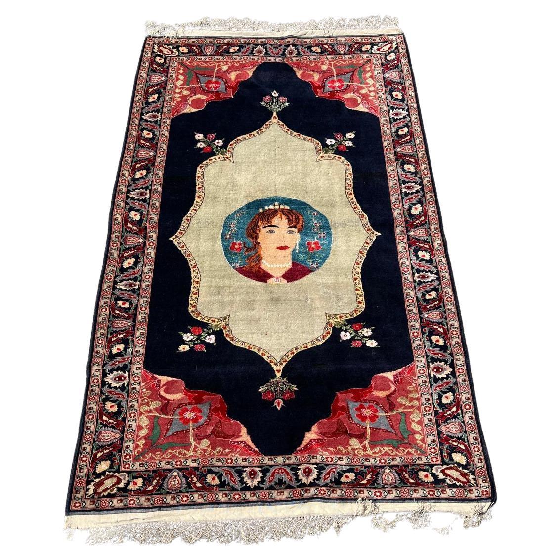 Antique Tabriz rug central medallion with rose and indigo accents

