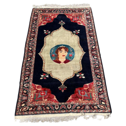 Antique Tabriz rug central medallion with rose and indigo accents

