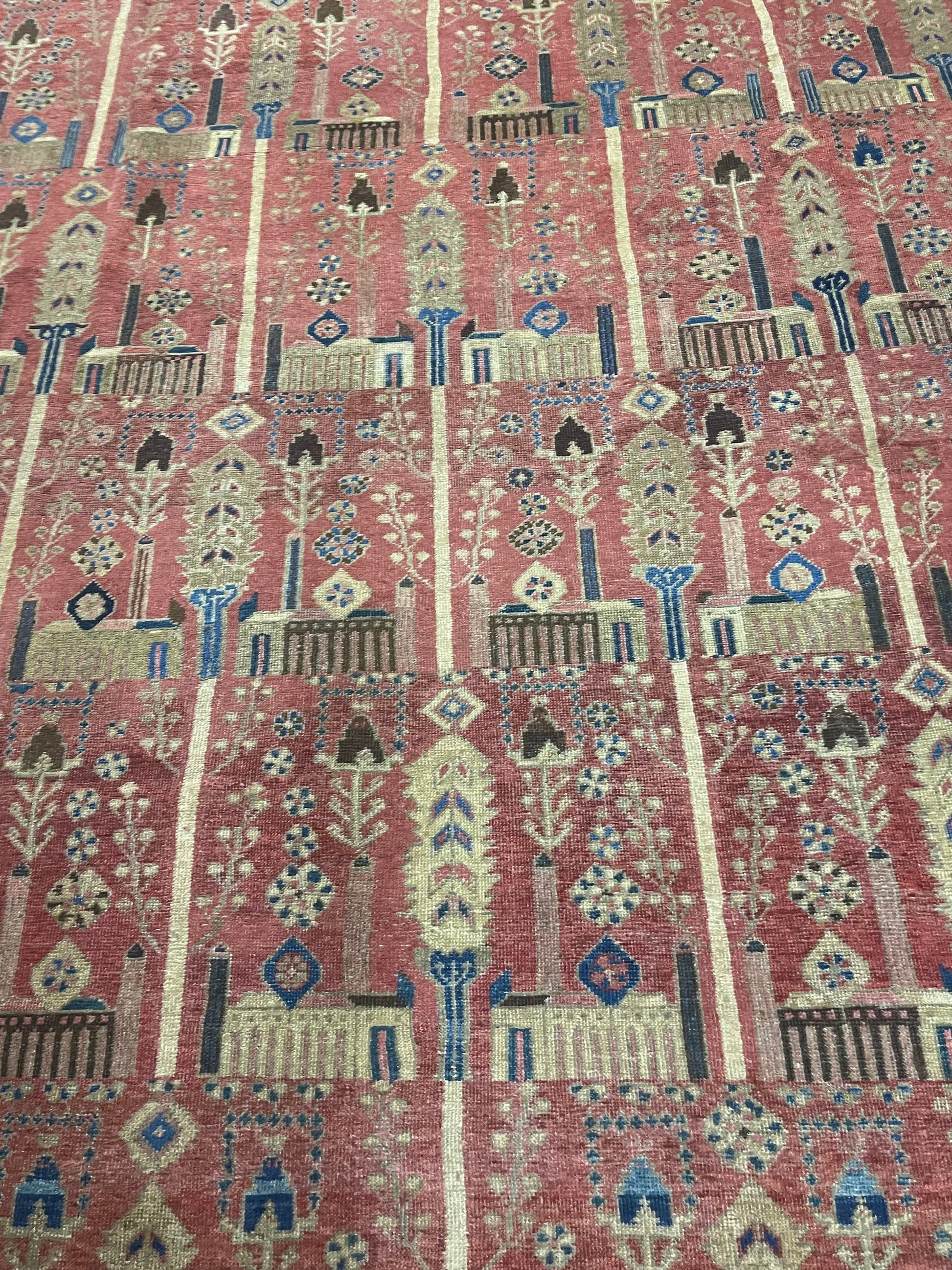 Close-up of the intricate traditional Persian patterns on the palace-sized rug