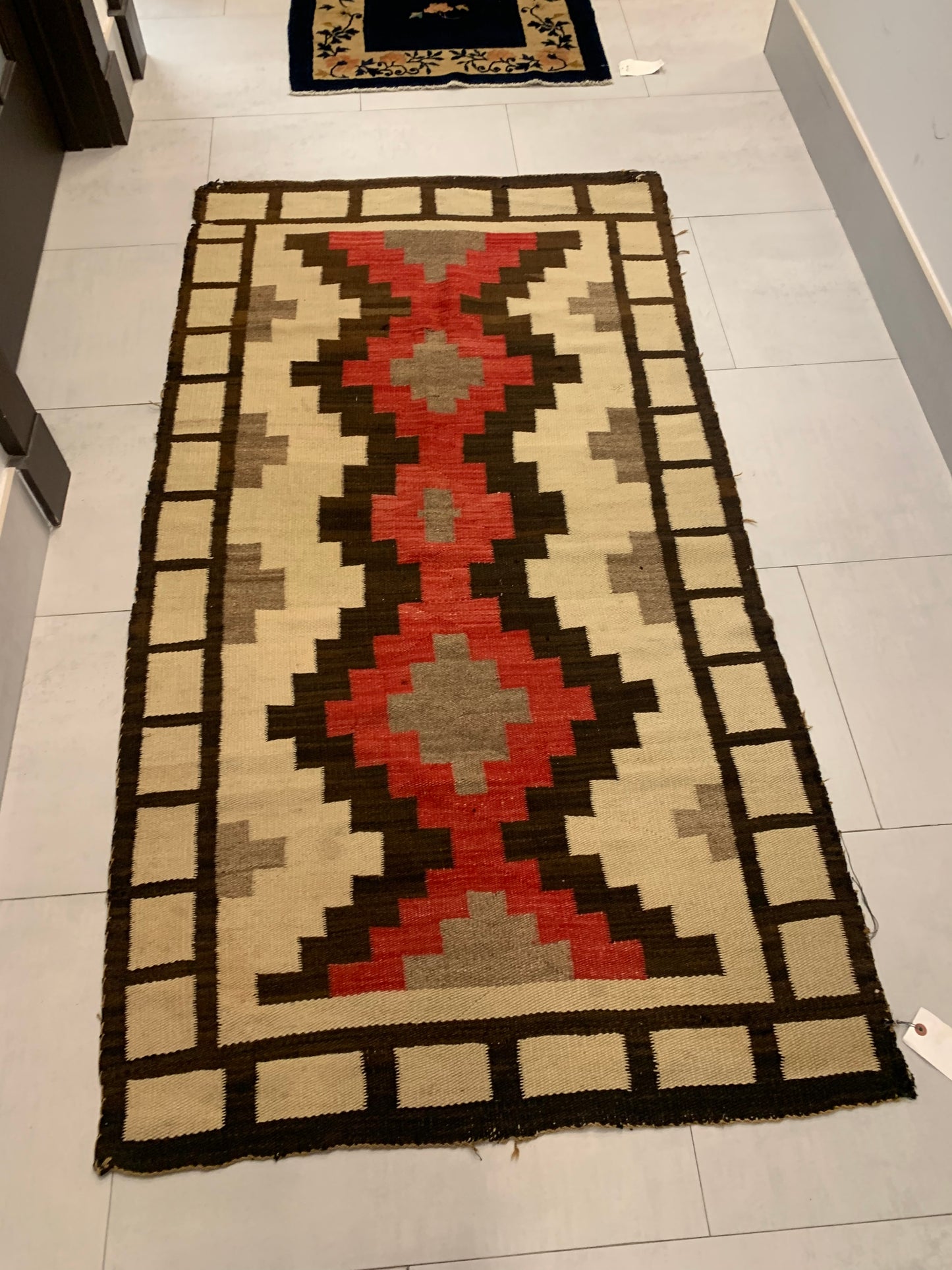 Side view of the Handmade Antique Native American Navajo Rug demonstrating texture