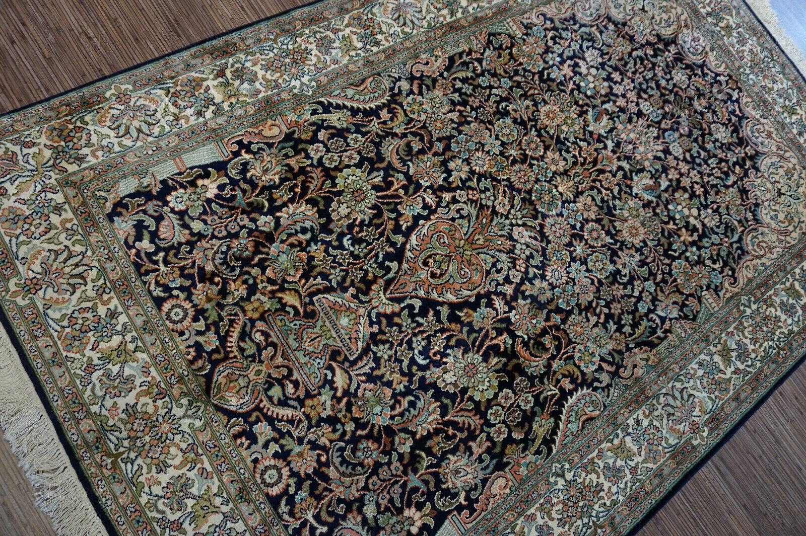 Side angle shot of the Handmade Vintage Persian Kashmir Rug showcasing size and scale