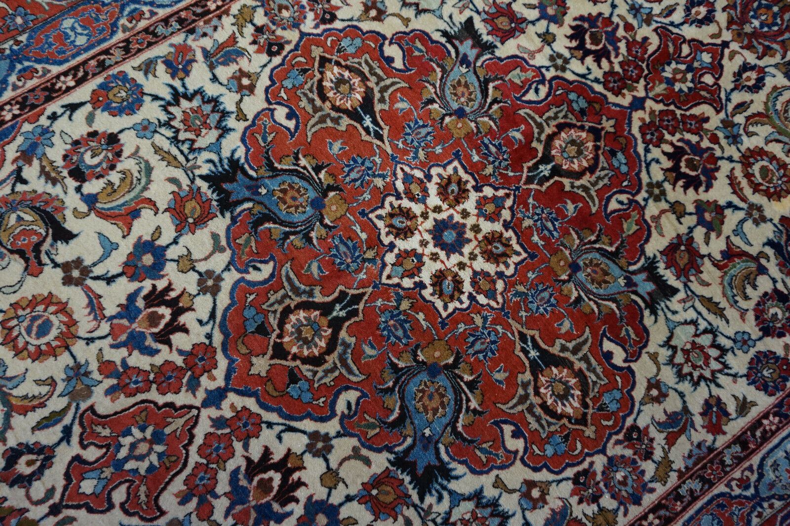 Side view of the Handmade Antique Persian Style Isfahan Rug demonstrating its fine weave structure