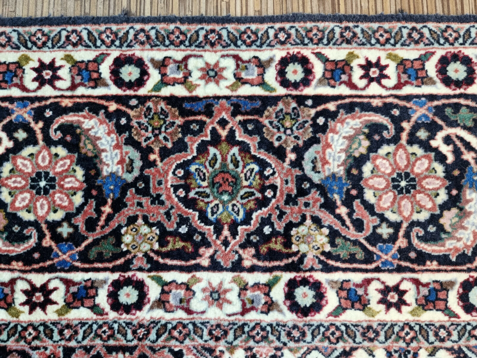 Close-up of captivating diamond-shaped central motif on Handmade Vintage Persian Bidjar Rug - Detailed view highlighting the central design element of the rug.