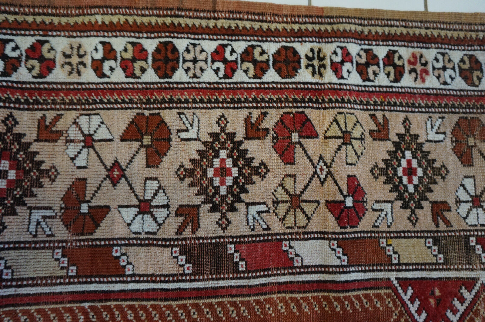 Side view of the Handmade Traditional Turkish Melas Rug demonstrating its durable wool material