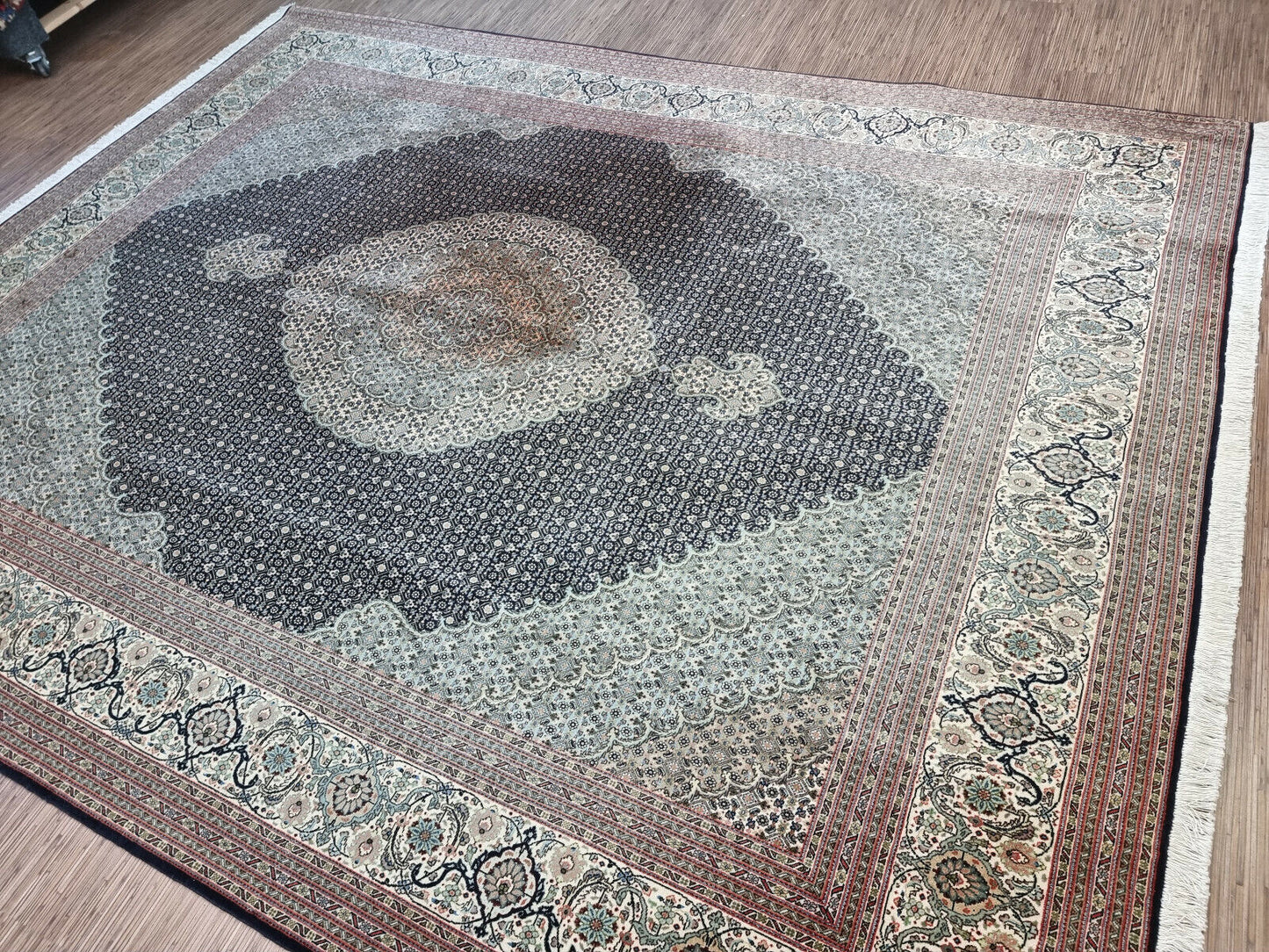 Close-up of the age discoloration and character of the medallion on the rug