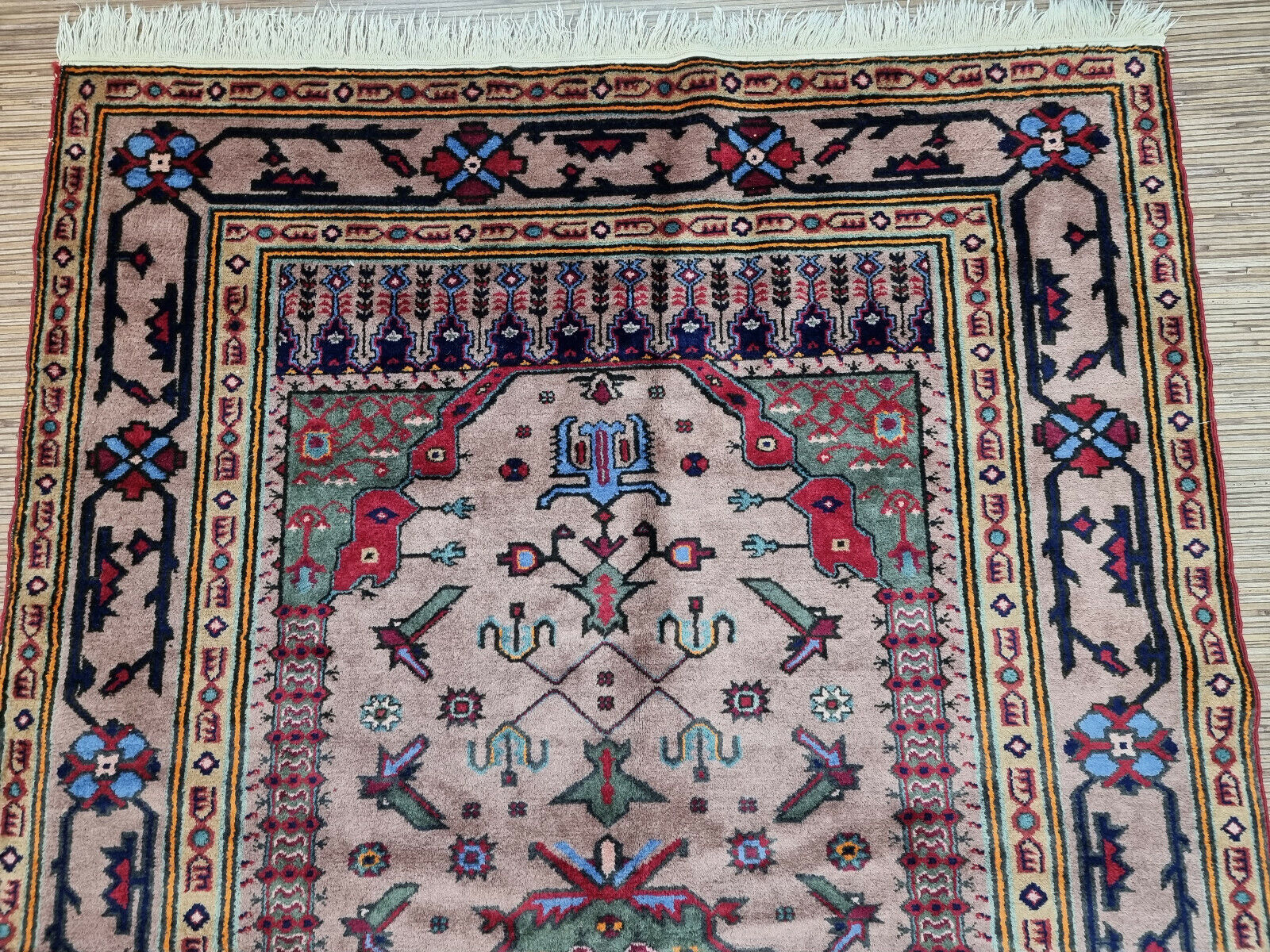 Close-up of craftsmanship on Handmade Vintage Caucasian Shirvan Rug - Detailed view showcasing the craftsmanship involved in creating the rug's intricate pattern.
