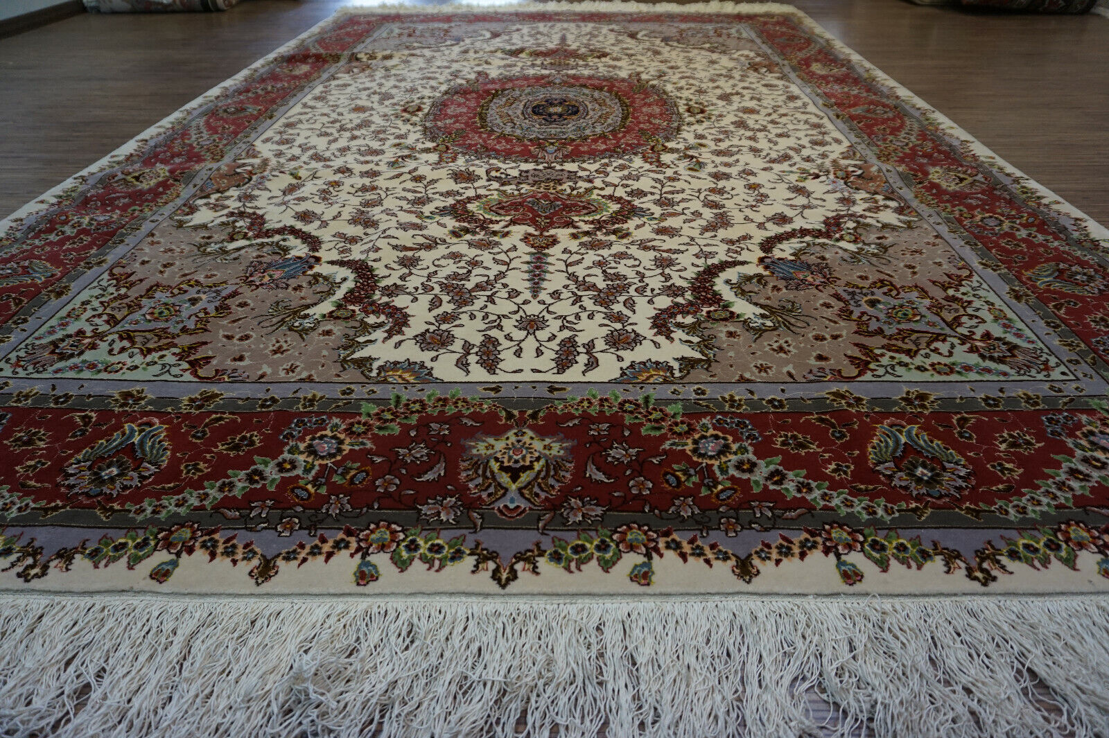  Close-up of the rich colors and fine detailing on the Persian Tabriz rug