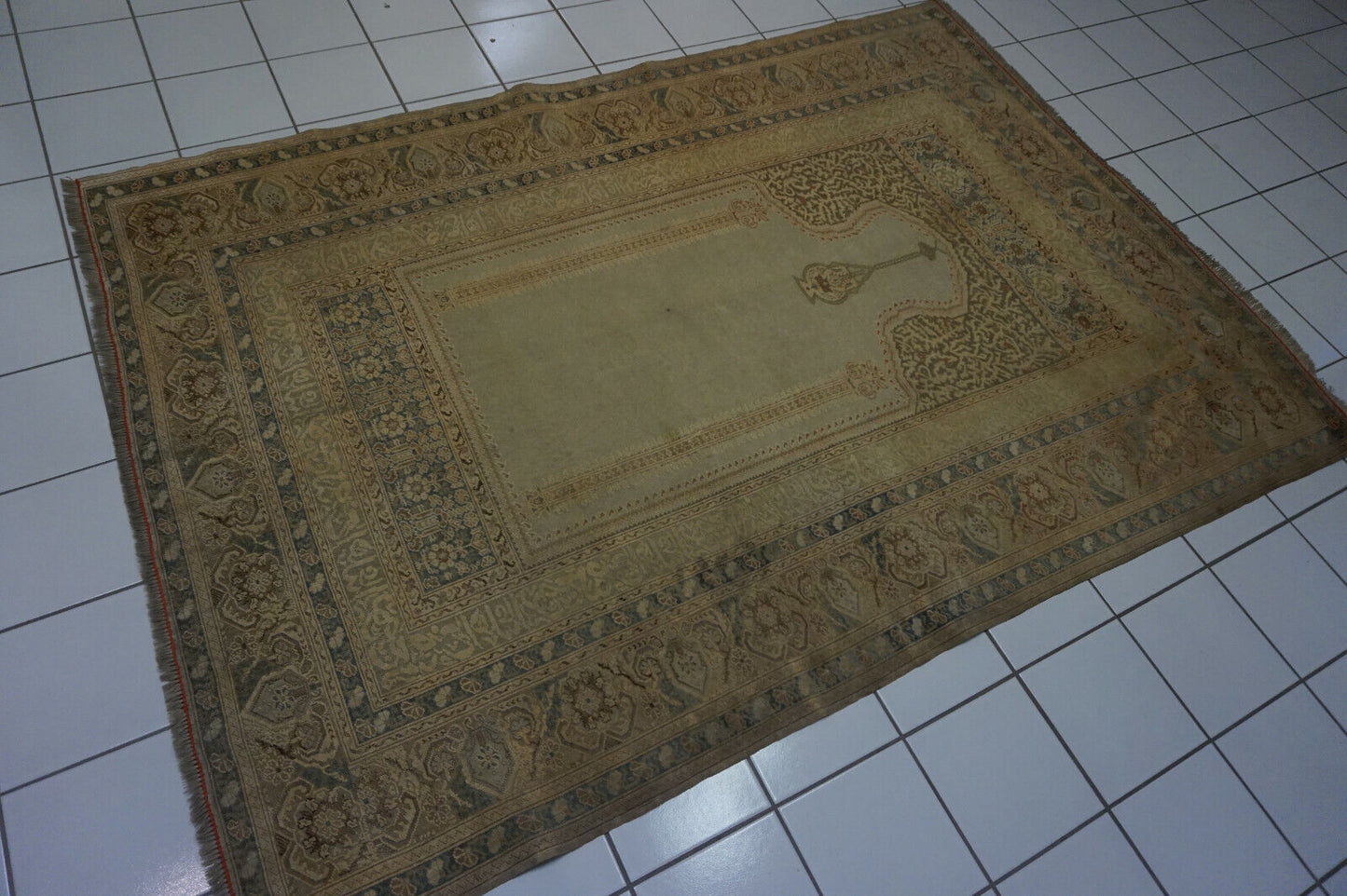 Angled shot of the Turkish Transilvania prayer rug adding warmth to a study area