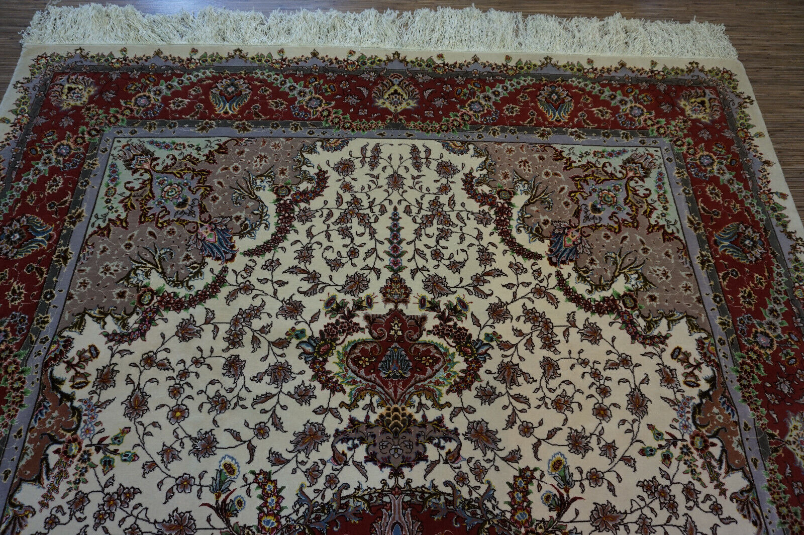  Front view of the Persian Tabriz rug complementing classic furniture in a dining area