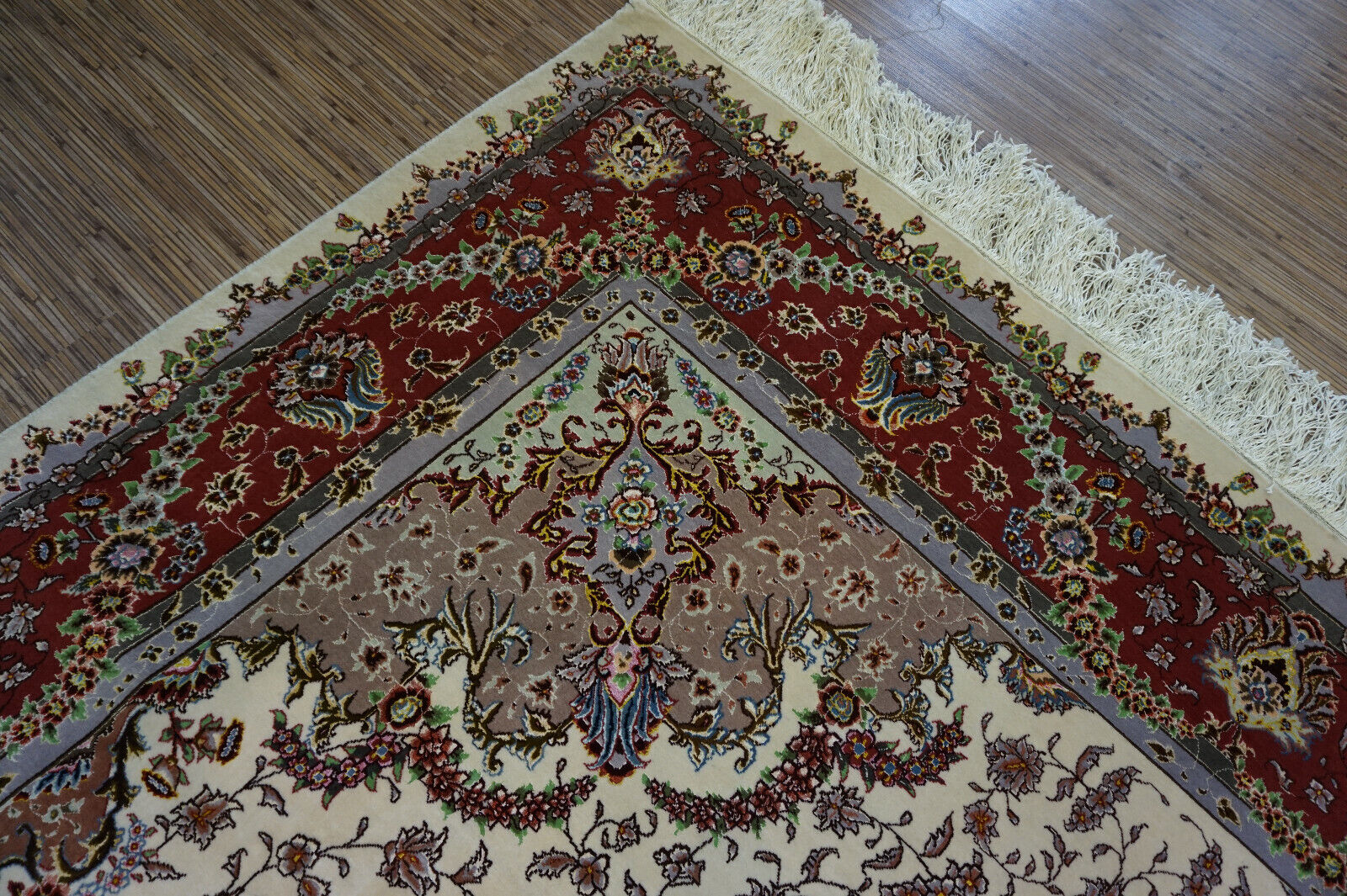 Close-up of the lustrous sheen and softness of the silk base of the Persian Tabriz rug