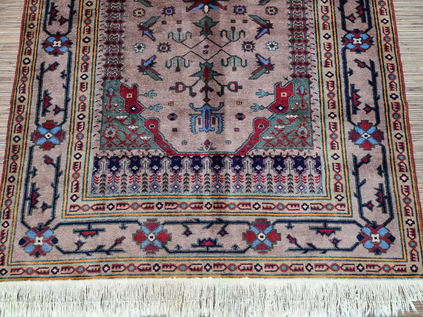 Close-up of red hues on Handmade Vintage Caucasian Shirvan Rug - Detailed view highlighting the rich red hues in the rug's design.