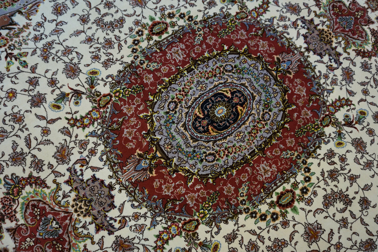 Detailed shot of the wool and silk pile of the Persian Tabriz rug