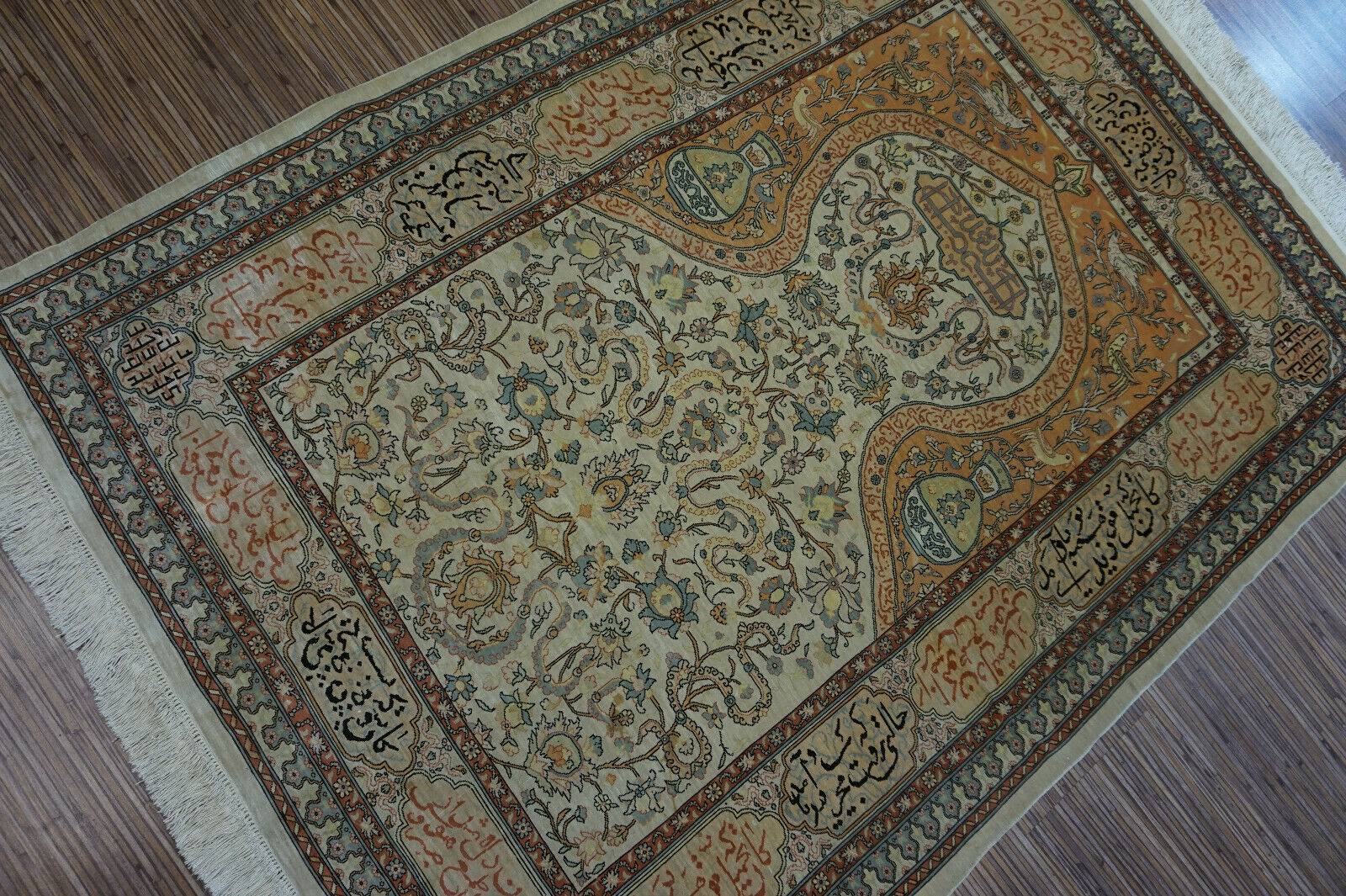 Detailed close-up of the intricate Arabic calligraphy on the Handmade Vintage Turkish Hereke Silk Rug