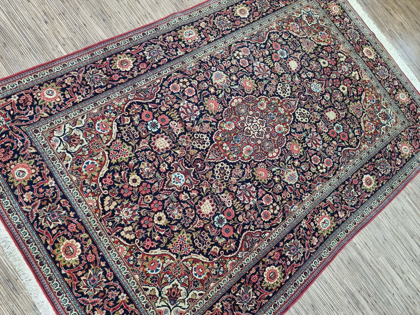 Close-up of charm on Handmade Antique Persian Kashan Rug - Detailed view highlighting the rug's charm and visual allure.