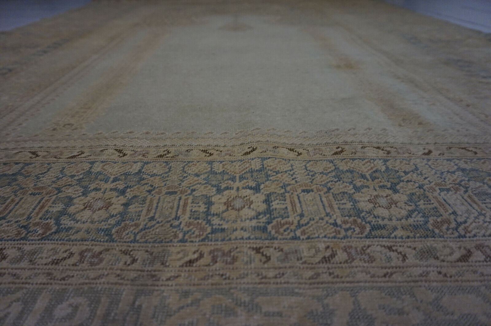 Overhead shot of the Turkish Transilvania prayer rug demonstrating its vintage charm