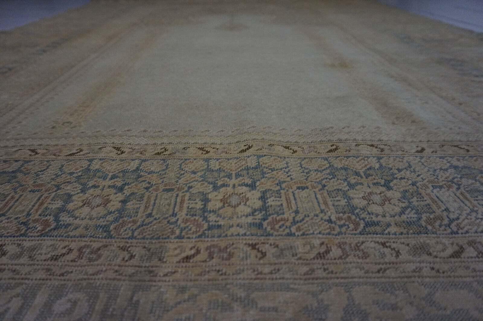 Overhead shot of the Turkish Transilvania prayer rug demonstrating its vintage charm
