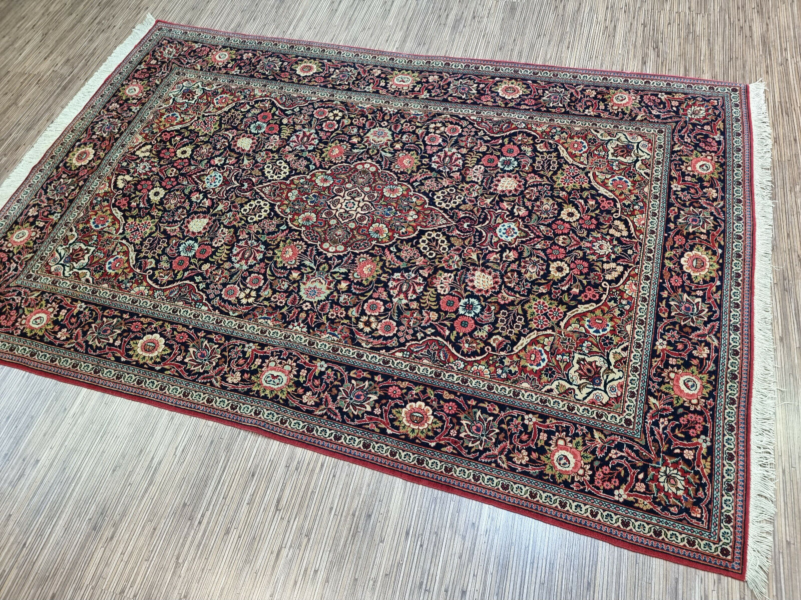 Close-up of craftsmanship on Handmade Antique Persian Kashan Rug - Detailed view showcasing the craftsmanship involved in creating the rug's intricate pattern.