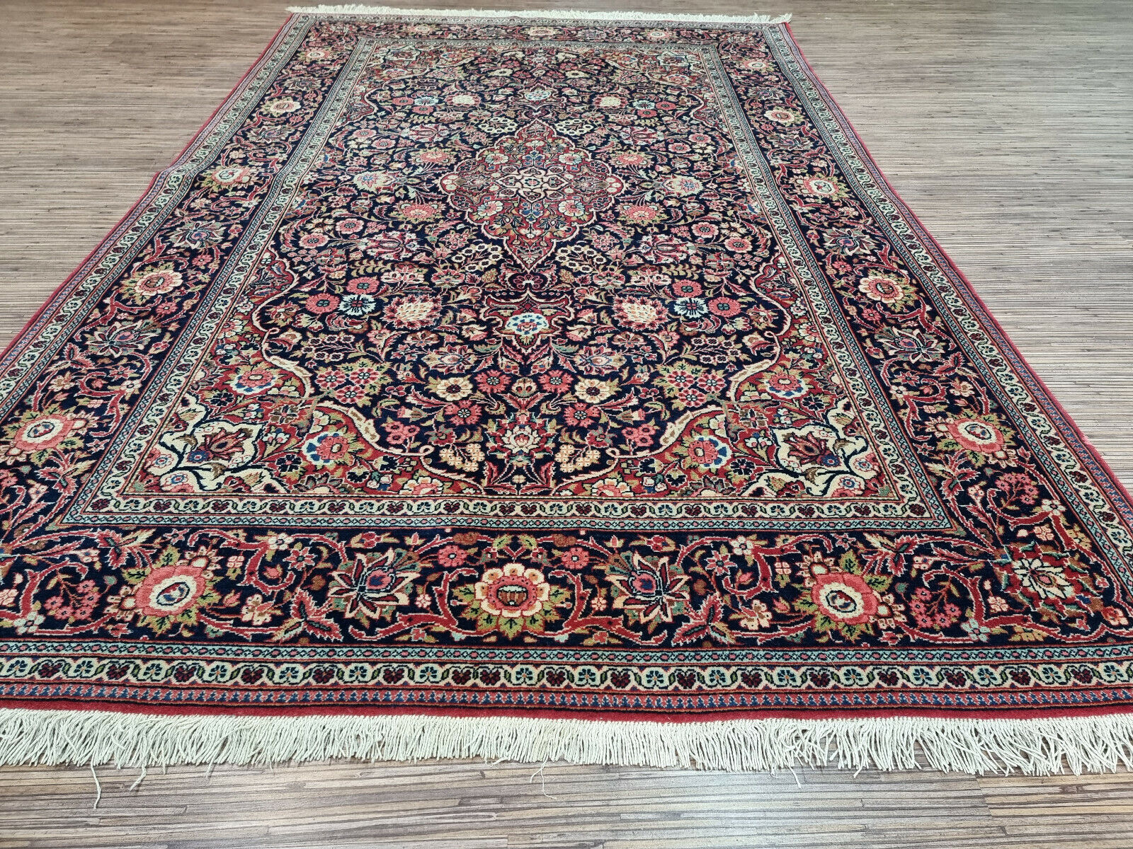 Close-up of warmth and coziness on Handmade Antique Persian Kashan Rug - Detailed view emphasizing the warmth and coziness provided by the wool texture.