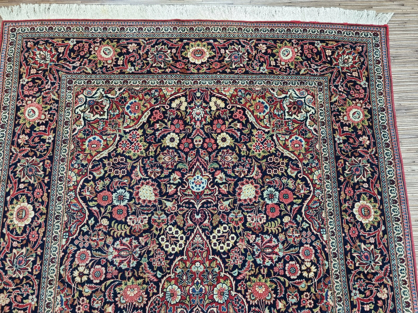 Close-up of intricate border patterns on Handmade Antique Persian Kashan Rug - Detailed view highlighting the complexity of the border patterns.