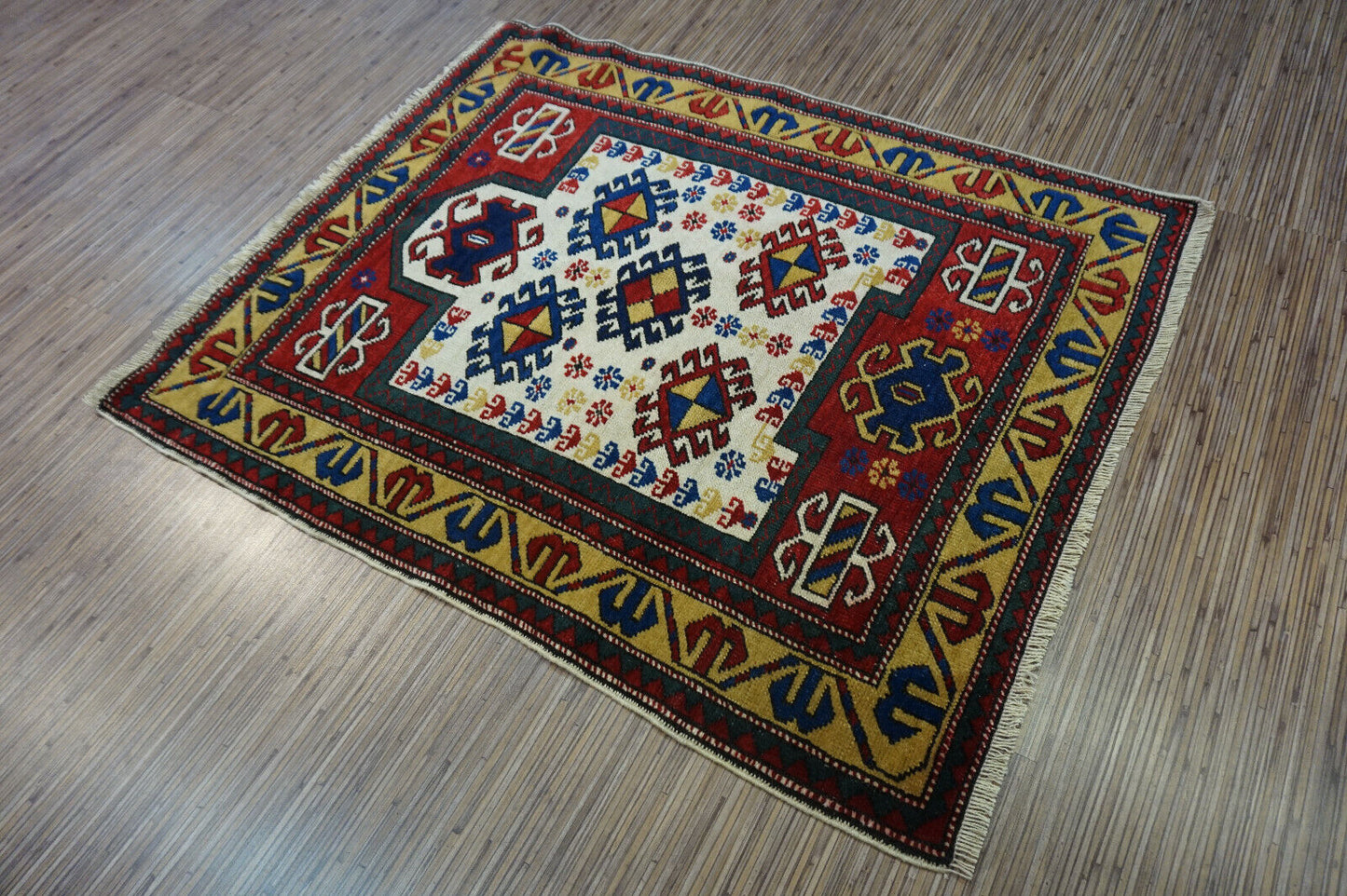 Detailed close-up of the border motifs enhancing the aesthetic harmony on the Handmade Antique Caucasian Kazak Prayer Rug