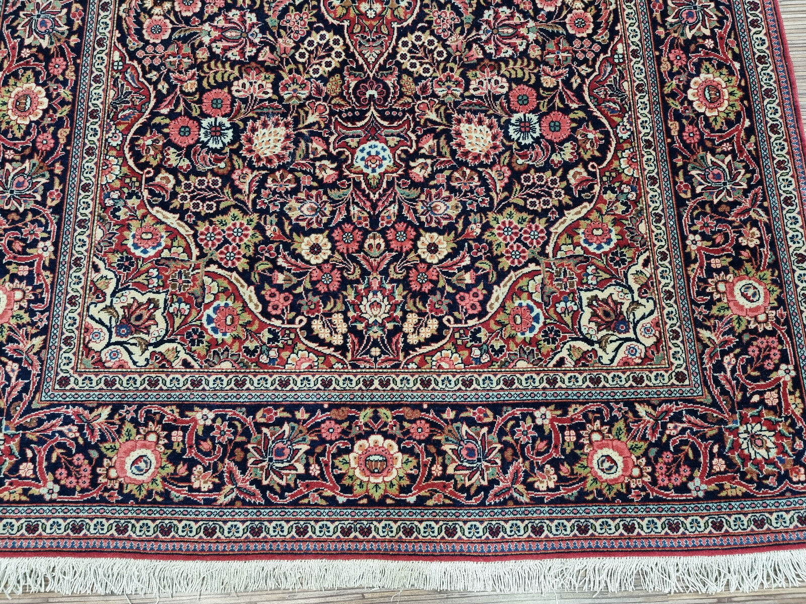 Close-up of geometric shapes on Handmade Antique Persian Kashan Rug - Detailed view showcasing the geometric shapes integrated into the rug's design.