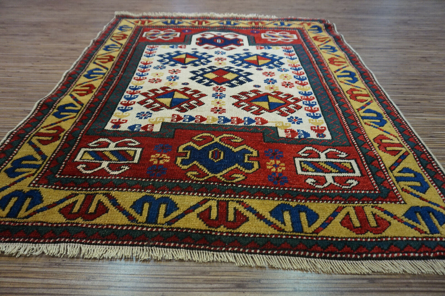  Artistic display of the Handmade Antique Caucasian Kazak Prayer Rug as a statement piece