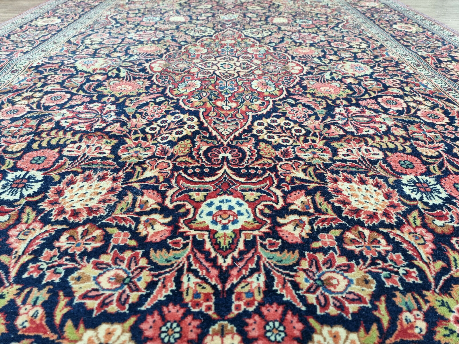 Close-up of central medallion design on Handmade Antique Persian Kashan Rug - Detailed view showcasing the prominent central medallion design.