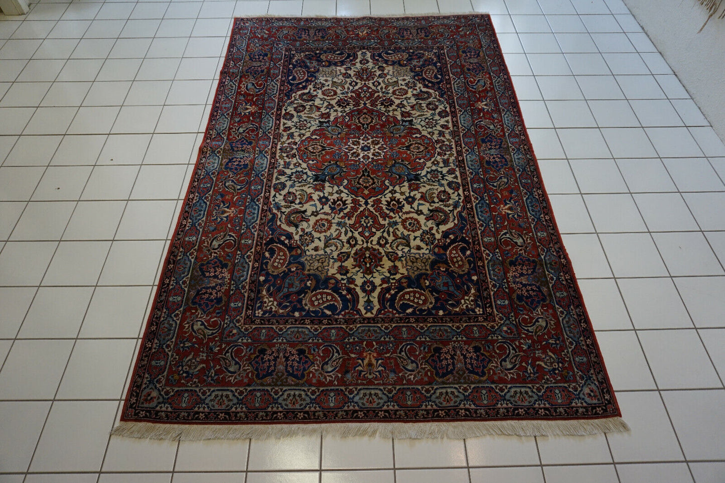 Side angle shot of the Handmade Antique Persian Style Isfahan Rug showcasing size and scale