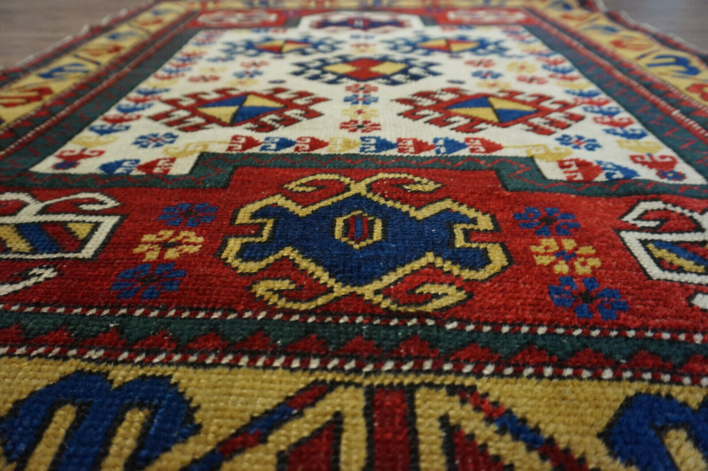 Overhead shot of the Handmade Antique Caucasian Kazak Prayer Rug displaying size and dimensions
