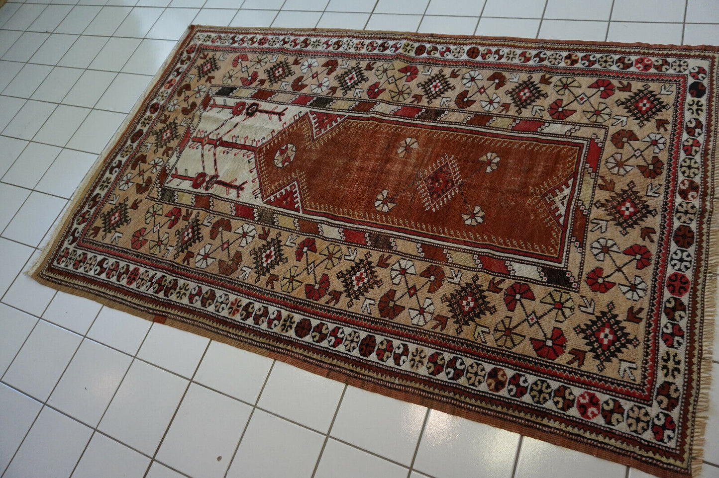 Detailed close-up of the geometric patterns and symbols on the Handmade Traditional Turkish Melas Rug