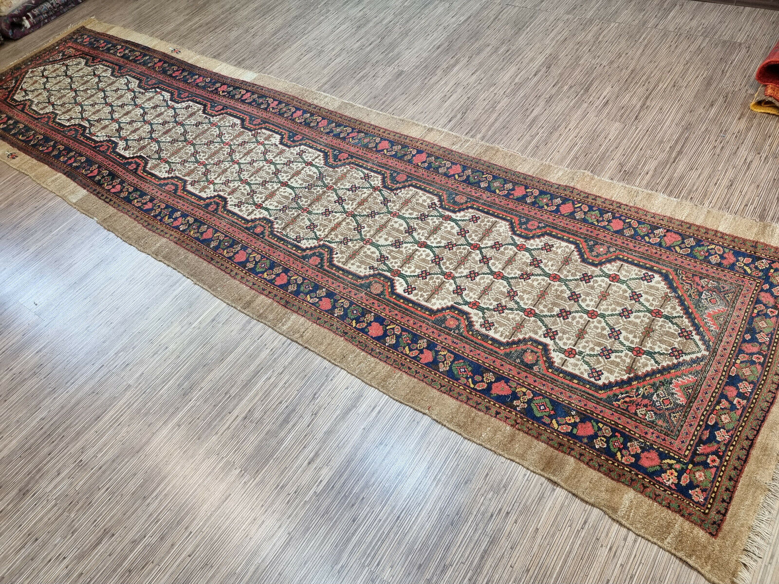 Close-up of soft and durable texture on Handmade Antique Persian Camel Hair Runner Rug - Detailed view showcasing the soft and durable texture of the rug's wool material.