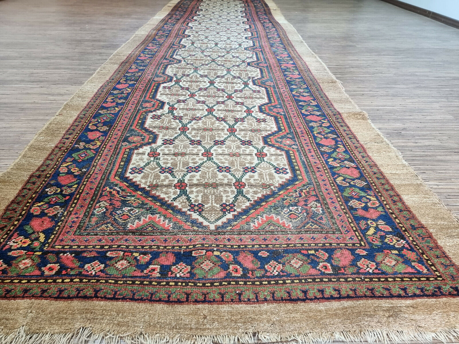Close-up of timeless artistry on Handmade Antique Persian Camel Hair Runner Rug - Detailed view highlighting the timeless artistry and craftsmanship evident in the rug's design.