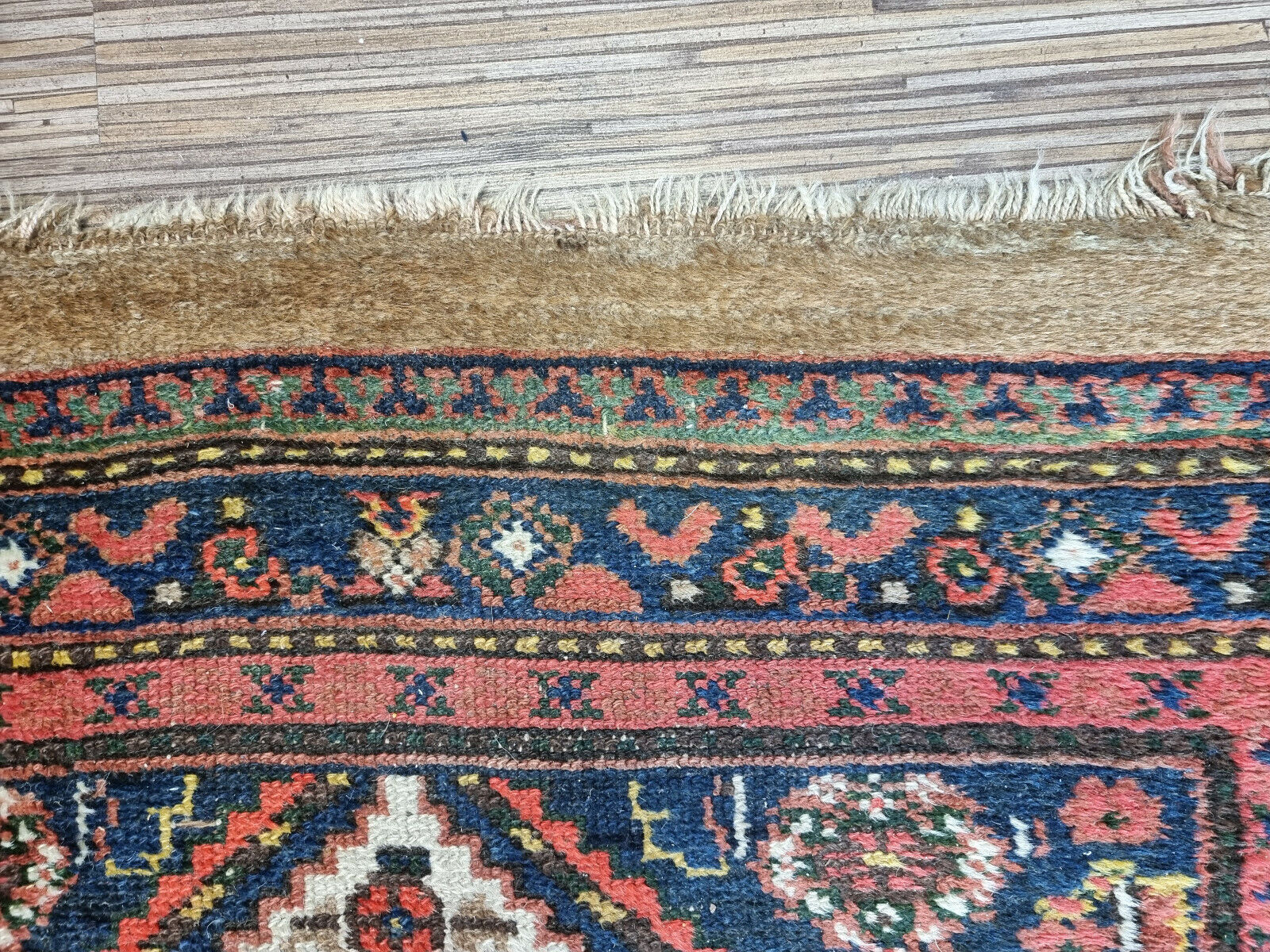 Close-up of cream-colored background on Handmade Antique Persian Camel Hair Runner Rug - Detailed view showcasing the cream-colored background of the rug's central field.