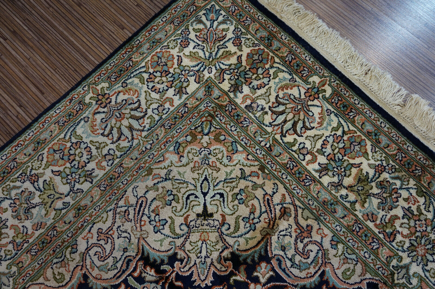 Close-up of the intricate borders framing the central design on the Handmade Vintage Persian Kashmir Rug