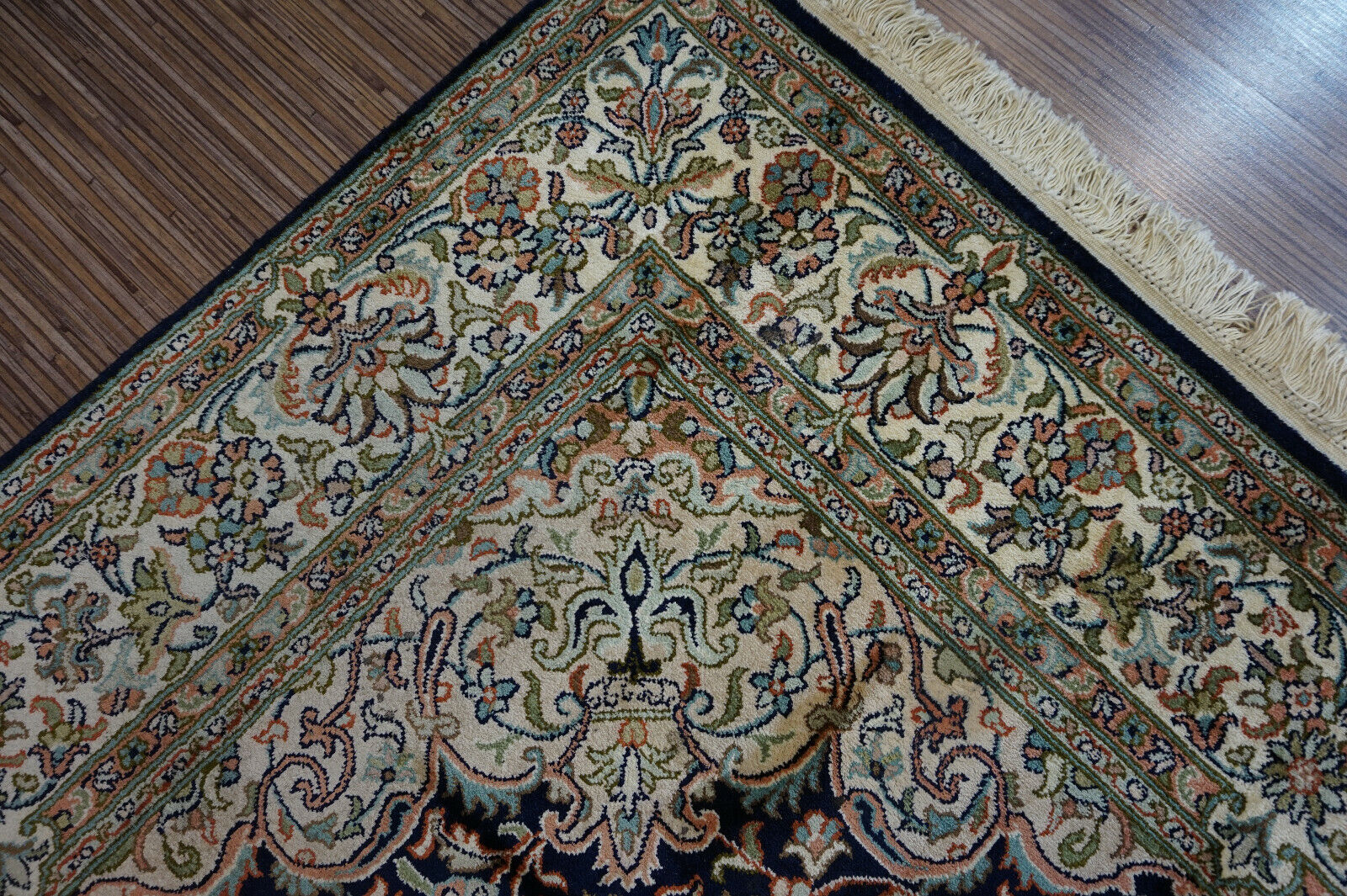 Close-up of the intricate borders framing the central design on the Handmade Vintage Persian Kashmir Rug