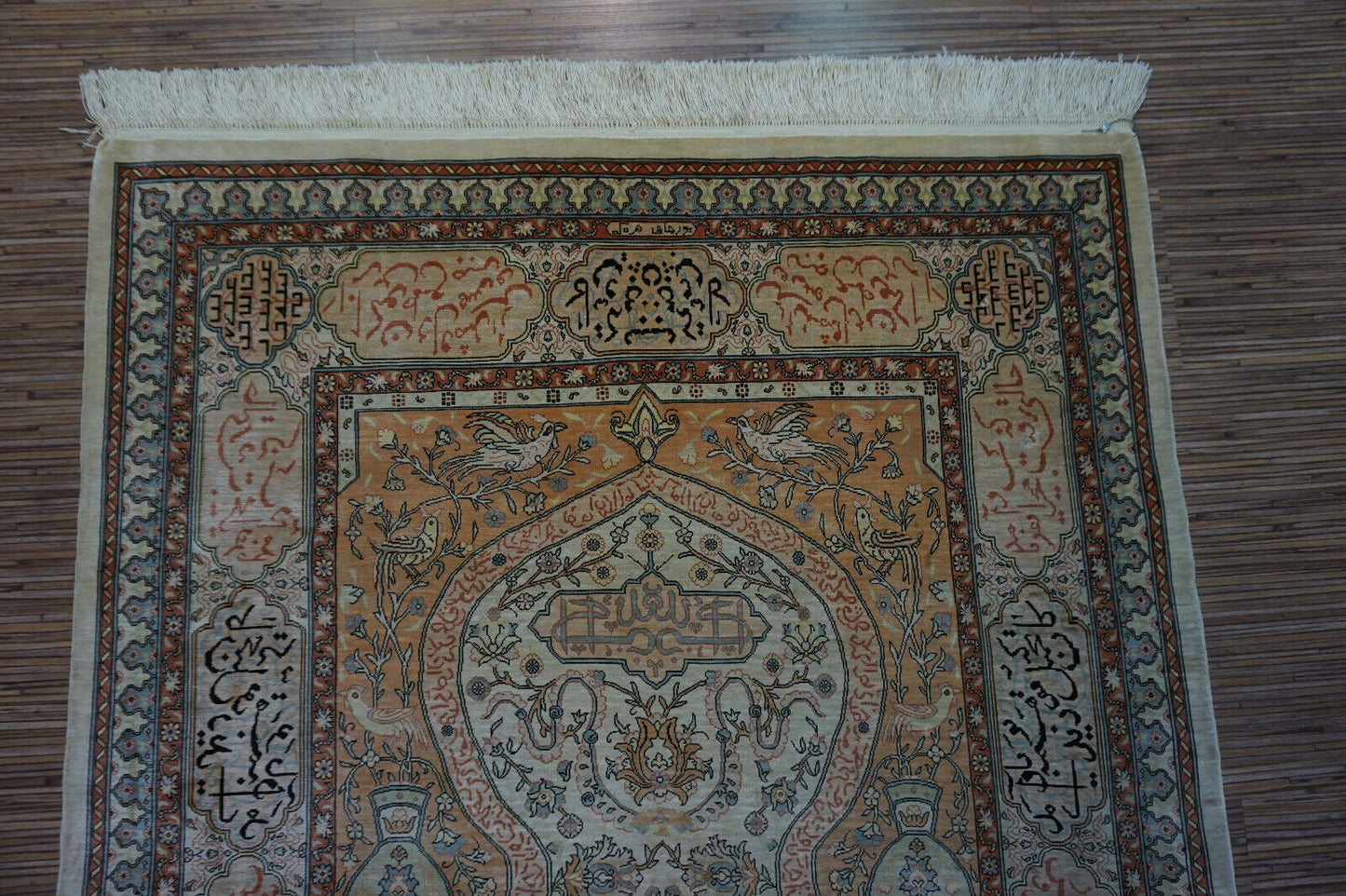 Close-up of the central field with lighter colors on the Handmade Vintage Turkish Hereke Silk Rug