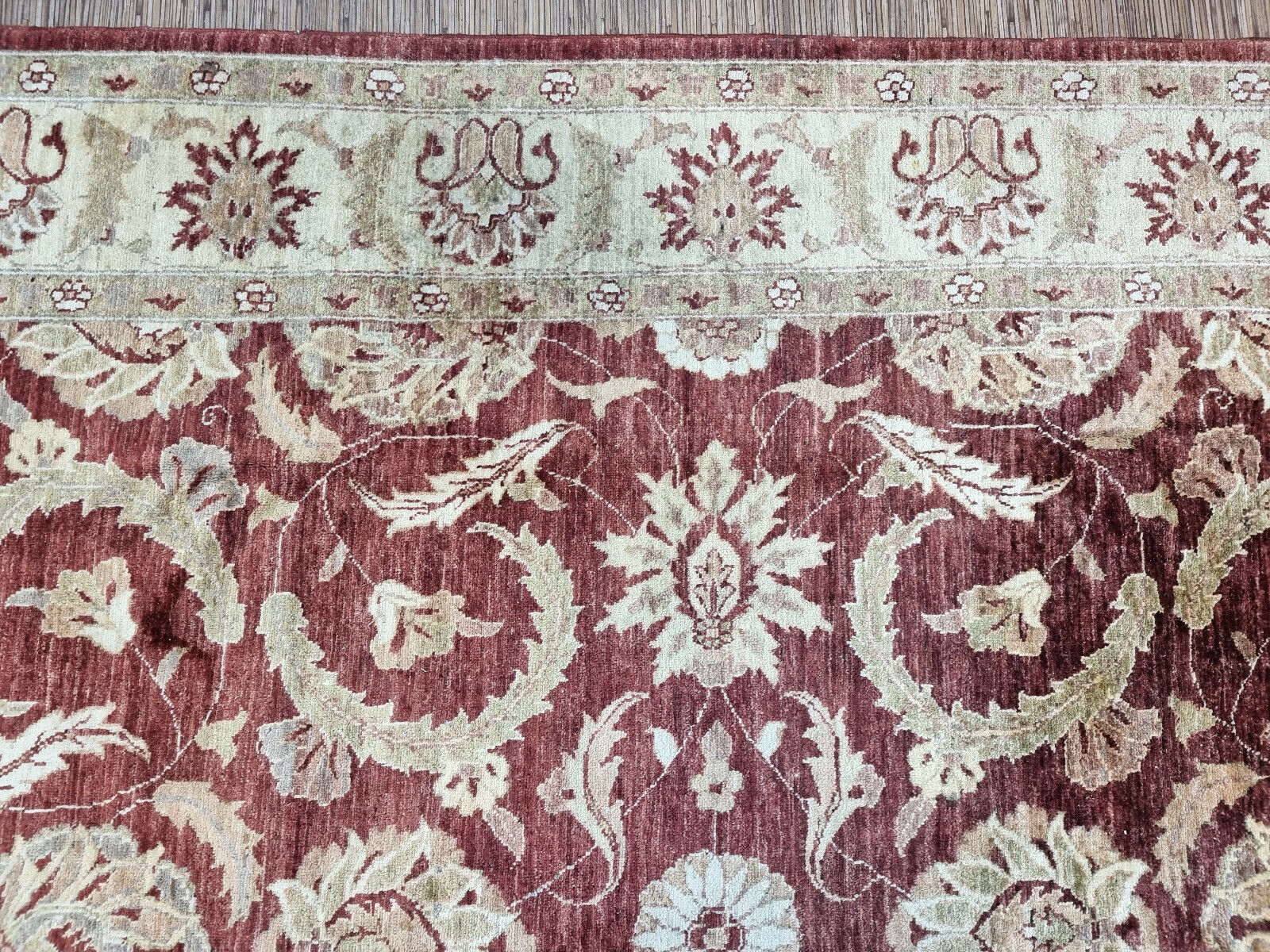 Close-up of intricate geometric designs on Handmade Vintage Afghan Zigler Rug - Detailed view emphasizing the intricate geometric designs decorating the rug.