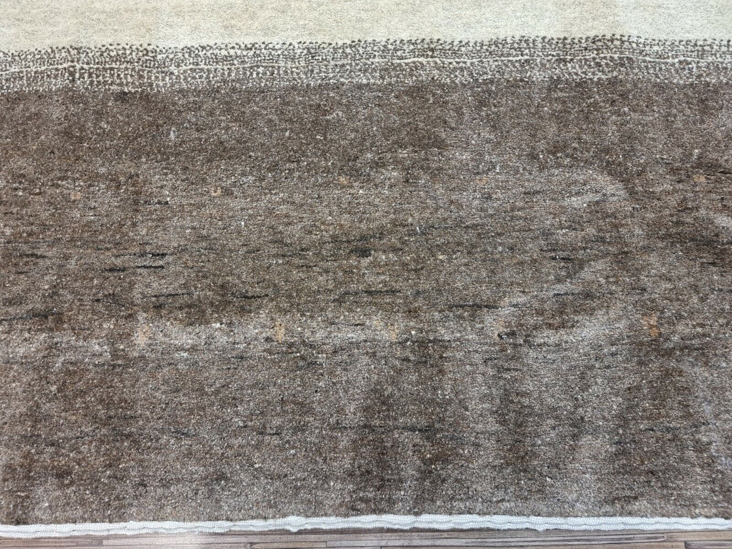 Overhead shot of the Handmade Vintage Persian Style Gabbeh Rug displaying size and dimensions