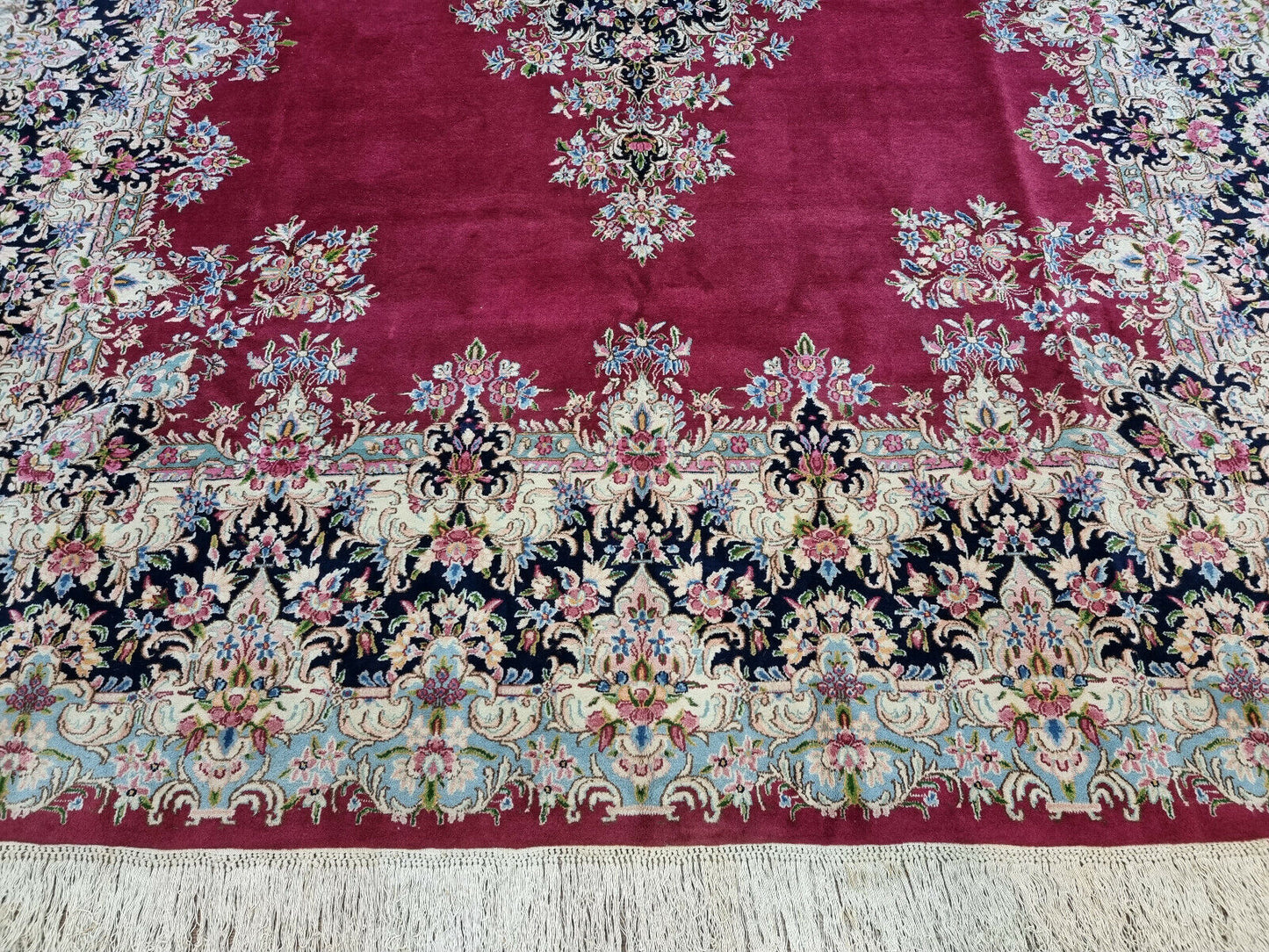 Close-up of rich deep red tones on Handmade Vintage Persian Kerman Rug - Detailed view showcasing the rich and deep red color palette of the rug.