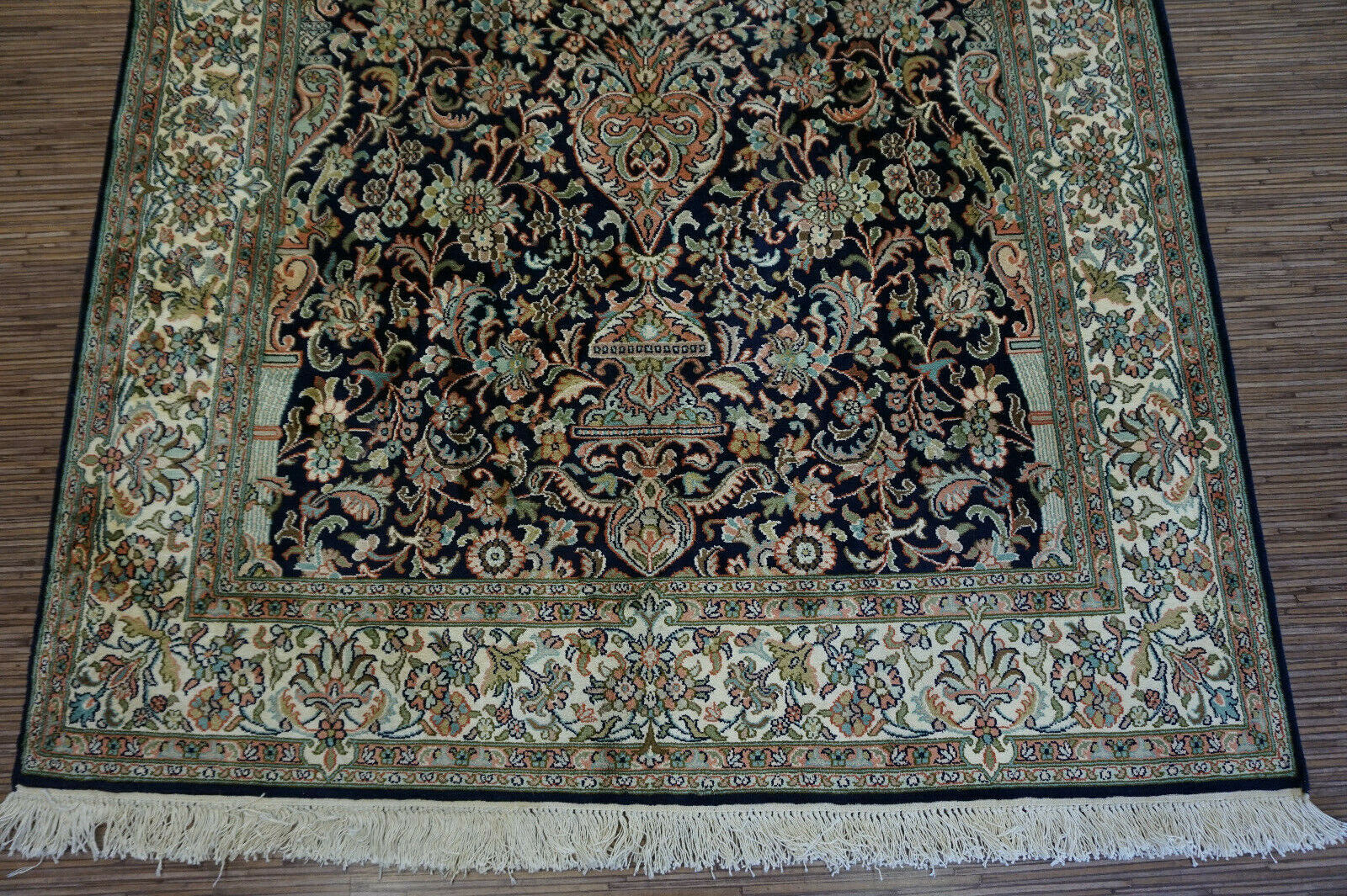 Side view of the Handmade Vintage Persian Kashmir Rug demonstrating its Kashmir artificial silk material