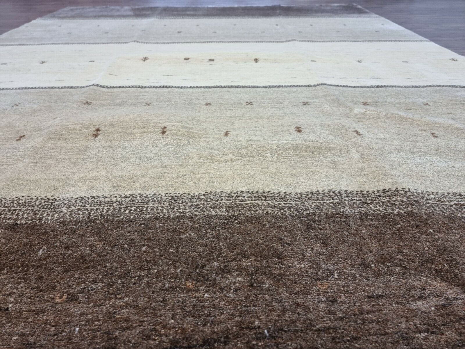 Side view of the Handmade Vintage Persian Style Gabbeh Rug demonstrating its thick woolen texture
